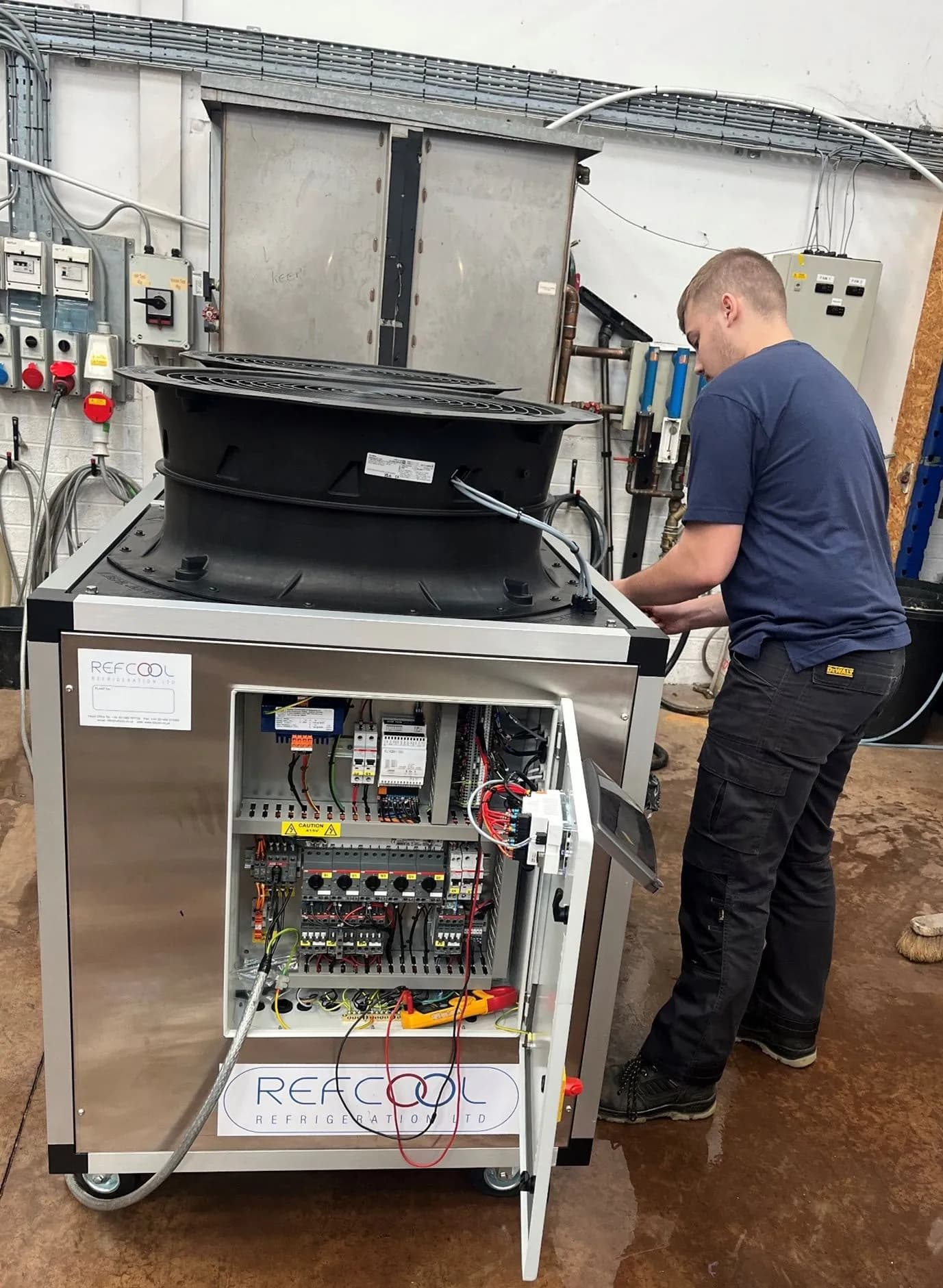 Refcool technician working on industrial cooling equipment
