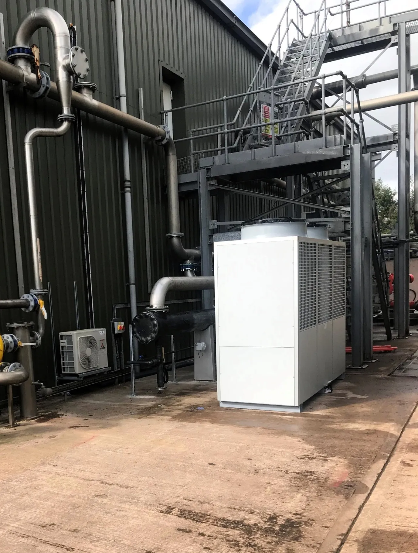 Large-scale industrial chiller installation with complex piping infrastructure